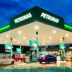 PETRONAS and Phoenix Petroleum executives shake hands after signing the memorandum of understanding for downstream marketing collaboration in the Philippines.