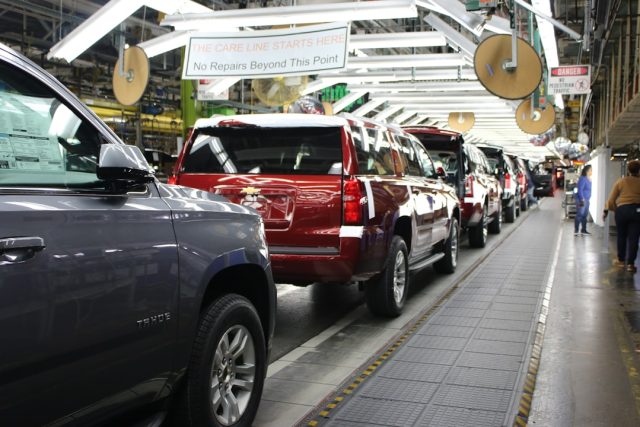 Malaysia's auto sector faces sales deadline as tax holiday nears end Workers on an assembly line in a Malaysian car plant restart production after the August 2021 lockdown ended.